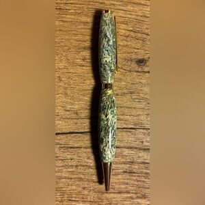 Hand turned acrylic ink pen with real money clippings. Black ink. Gold accents.